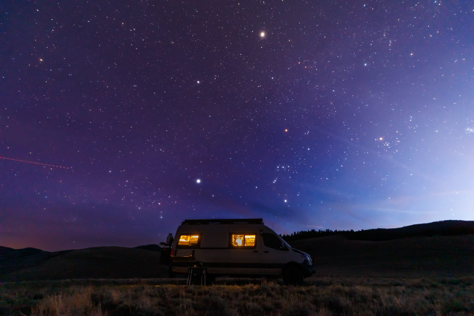 Spread: a van under stars, full bleed